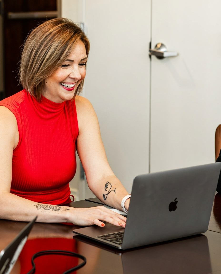April Poynter at her laptop, engaged and approachable